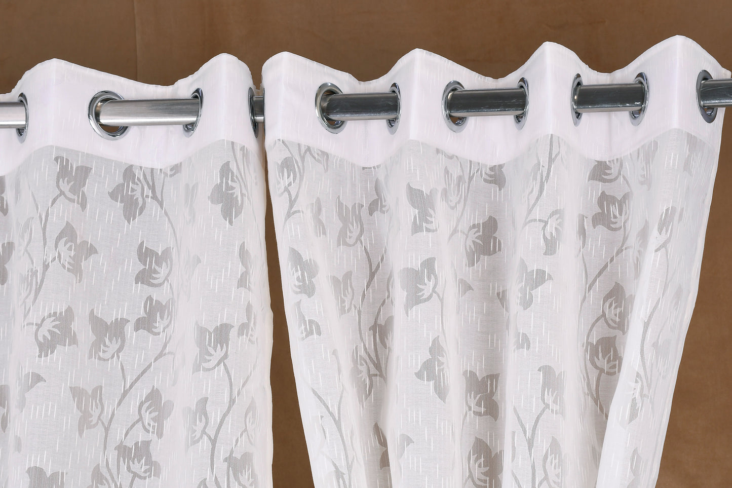 Mero Collection Curtains with Eyelet patttern in Sheer fabric with self textures in Pearl White Colour Motif Leaf Brasso