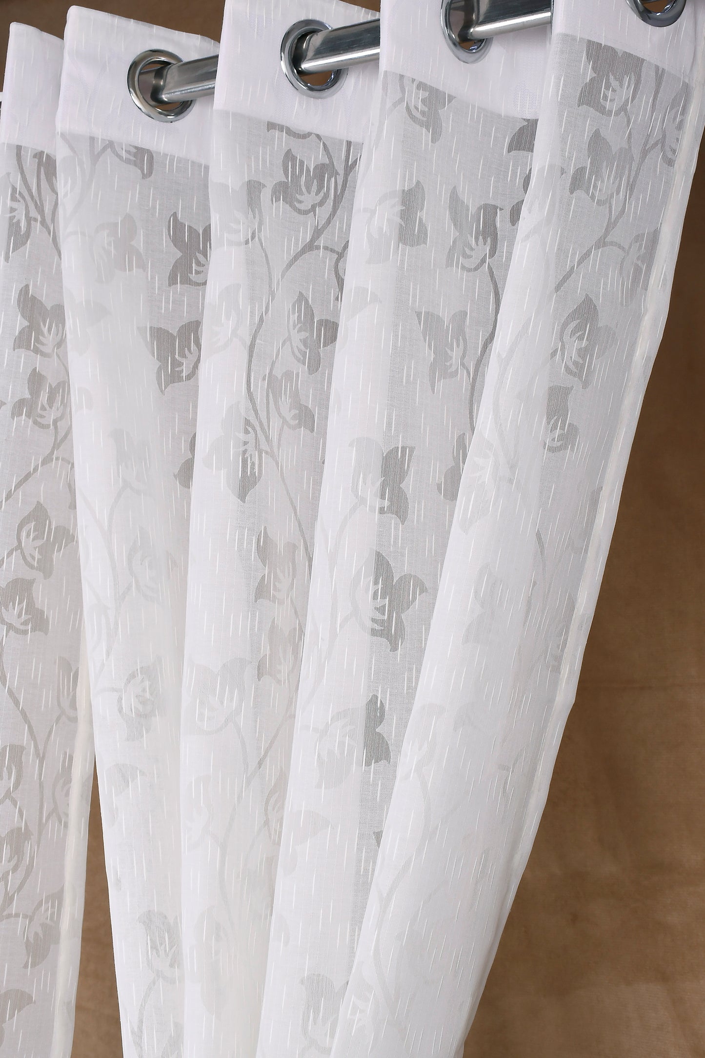 Mero Collection Curtains with Eyelet patttern in Sheer fabric with self textures in Pearl White Colour Motif Leaf Brasso