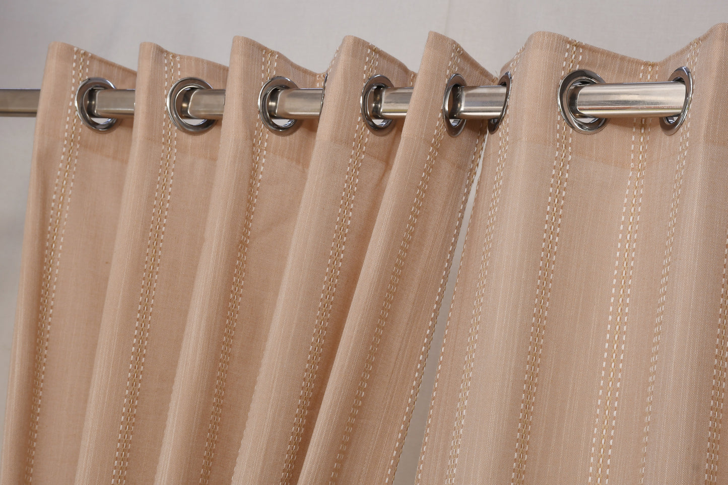 Ricamo Collection Curtains in Eyelet patttern with Stripe Embroidered Work Design in Peach Colour.